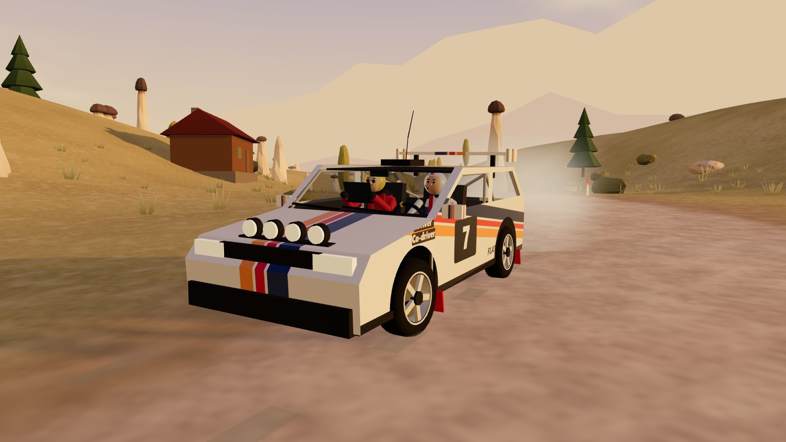 A rally car at sunrise near fairy chimneys.